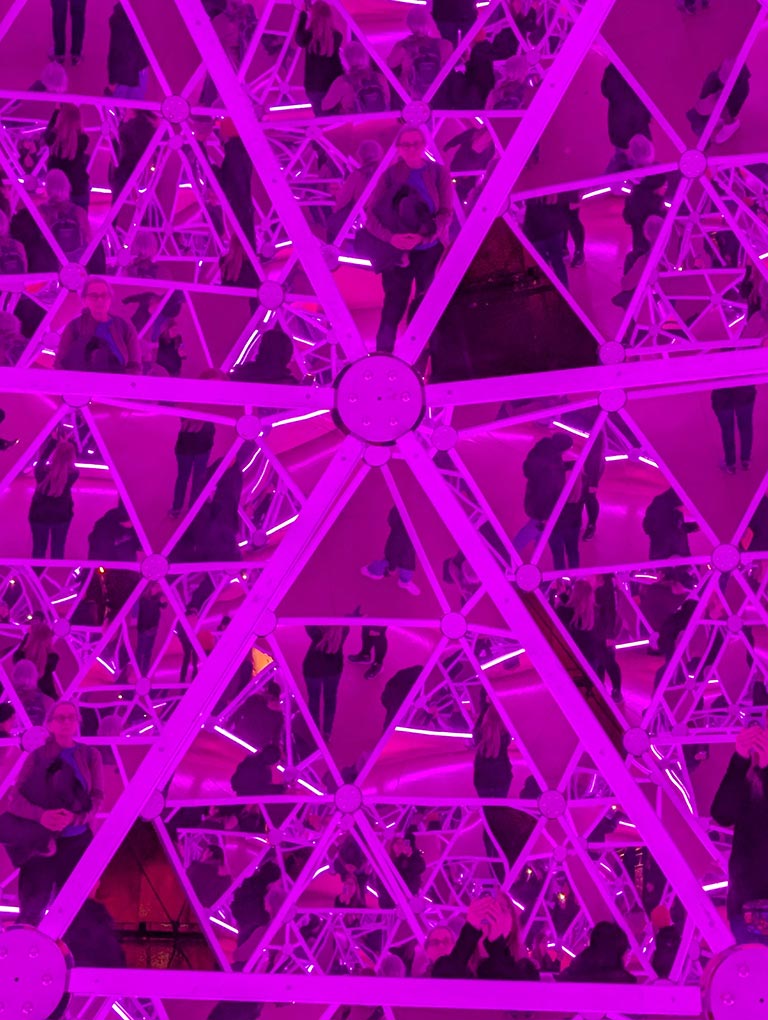 The inside of the mirrored Dalidom with magenta lighting