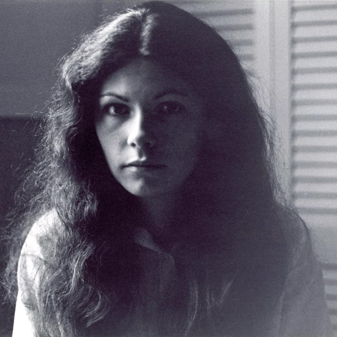 Black and white self-portrait photograph of Sue Runkowski.